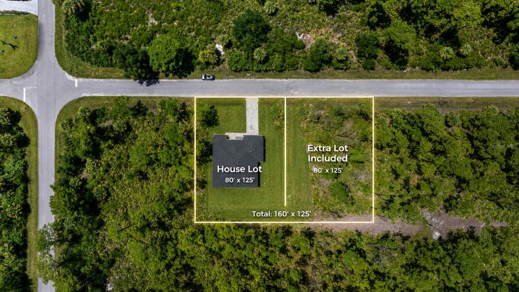 This aerial view shows a house on a lot with an adjacent vacant lot included — 372 MATSON LANE, PORT CHARLOTTE, FL