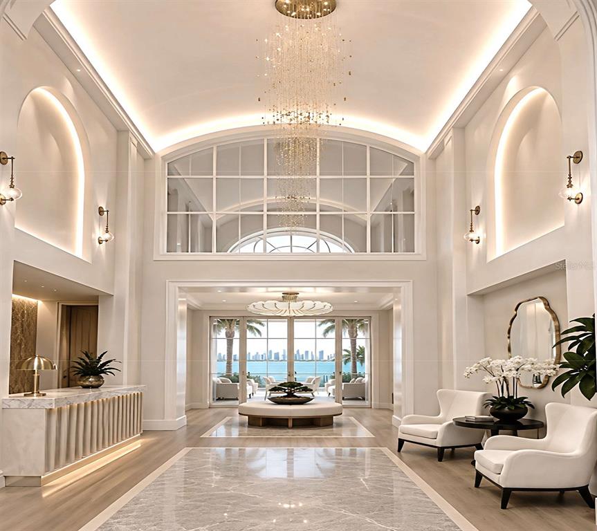 This rendering shows a grand, high-ceilinged lobby with a crystal chandelier, marble floors, and ocean views — 464 GOLDEN GATE POINT UNIT 702, SARASOTA, FL