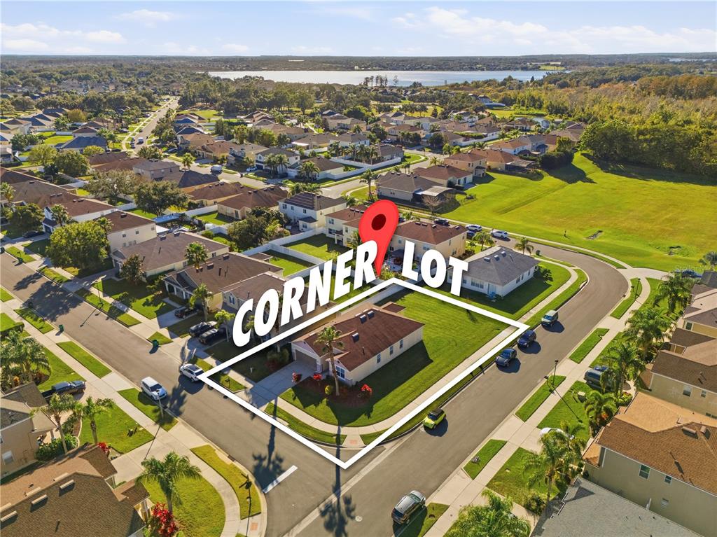 An aerial view shows a single-story house situated on a residential corner lot — 502 FIRST CAPE CORAL DR, WINTER GARDEN, FL