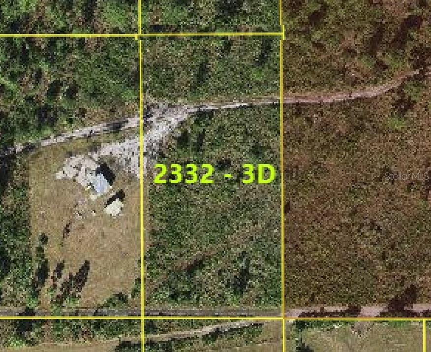 This is an aerial map view showing a plot of land with a small structure — SUBURBAN ESTS SEC 25...2332 003D, ST CLOUD, FL