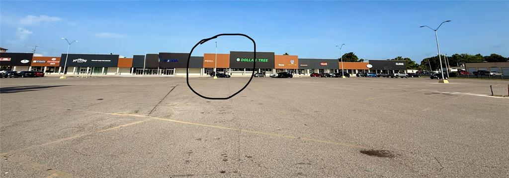 A wide-angle exterior view of a strip mall featuring a Dollar Tree storefront — 6830 14TH STREET W UNIT A, BRADENTON, FL