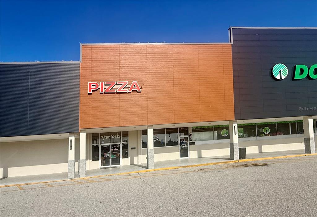 A storefront with a pizza sign and a Dollar Tree sign in a strip mall — 6830 14TH STREET W UNIT A, BRADENTON, FL