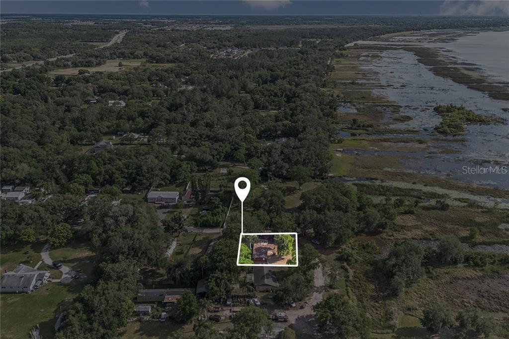 An aerial view shows a house highlighted by a white box and location pin — 4791 SUNSET ROAD, ST CLOUD, FL