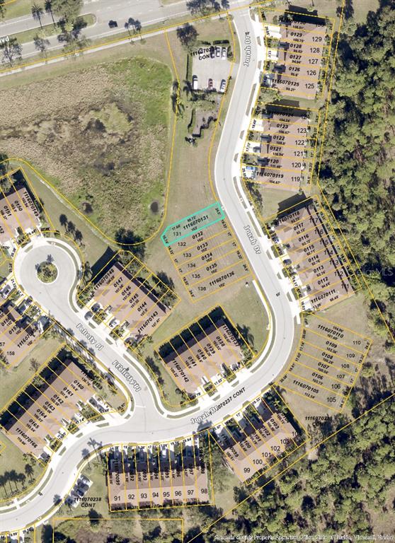 This is an aerial map showing a residential neighborhood with houses and vacant lots — 1310 JONAH DRIVE, NORTH PORT, FL