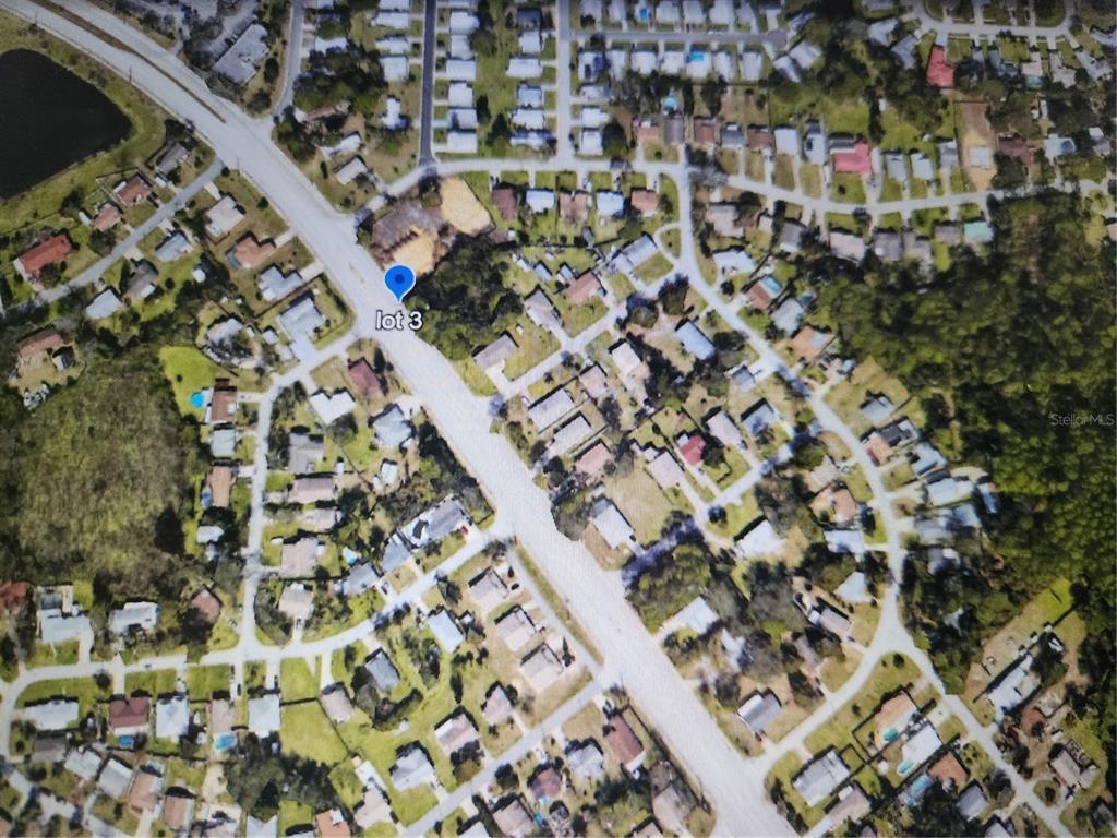 This aerial map shows a residential neighborhood with a highlighted lot — S NOVA ROAD, PORT ORANGE, FL