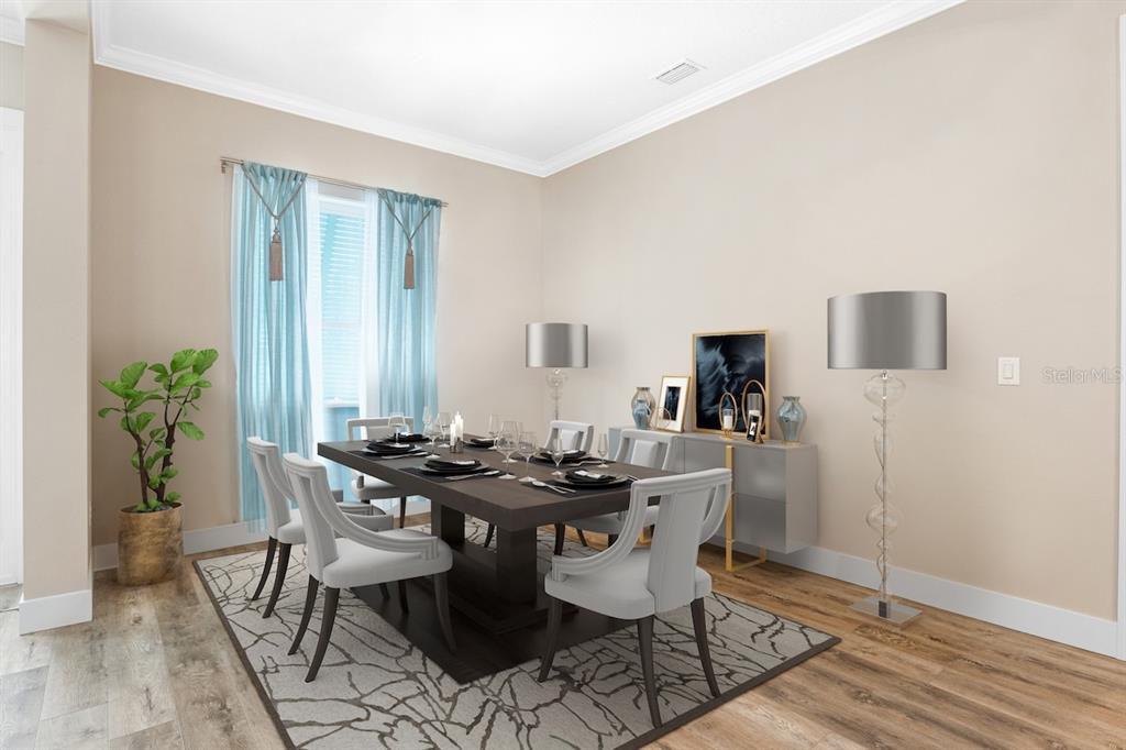 This dining room features a dark wood table, upholstered chairs, and a patterned area rug — 1148 BAHIA HONDA KEY DRIVE, LADY LAKE, FL