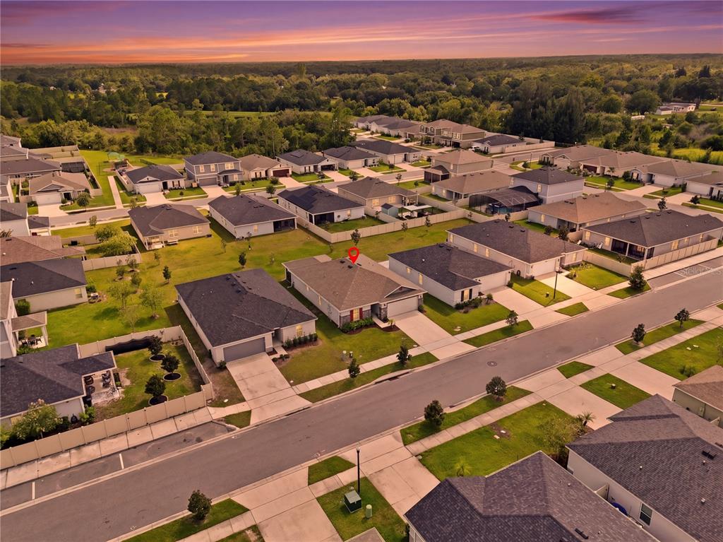 An aerial view shows a suburban neighborhood with a red pin marking a single-family home — 3842 WHITETAIL COURT, ST CLOUD, FL