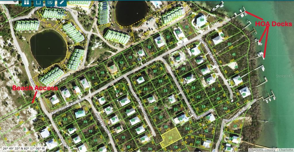 This is a satellite map showing a residential neighborhood with highlighted property lots and docks — 9574 BUCCANEER TRAIL, PLACIDA, FL