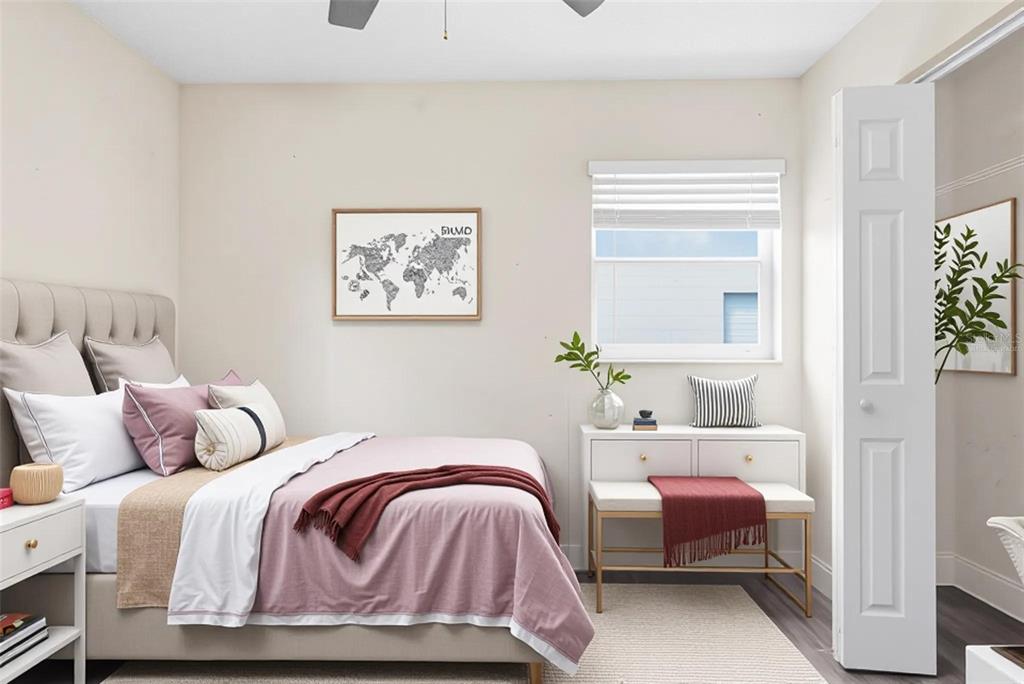 A bedroom features a bed with pink bedding, a white dresser, and a world map print — 4788 PLEASANT VALLEY COURT, ORLANDO, FL