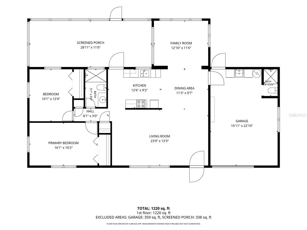 A bathroom features a white vanity, a toilet, and a shower area with a floral curtain — 11450 80TH AVENUE, SEMINOLE, FL