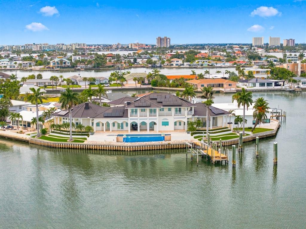 An aerial view of a large waterfront house with a pool and private boat dock — 5400 PALI WAY, ST PETE BEACH, FL
