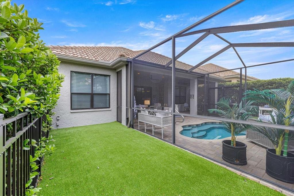 A single-story house with a two-car garage, stucco exterior, and a tile roof at dusk — 1763 W TWILIGHT LANE, HERNANDO, FL