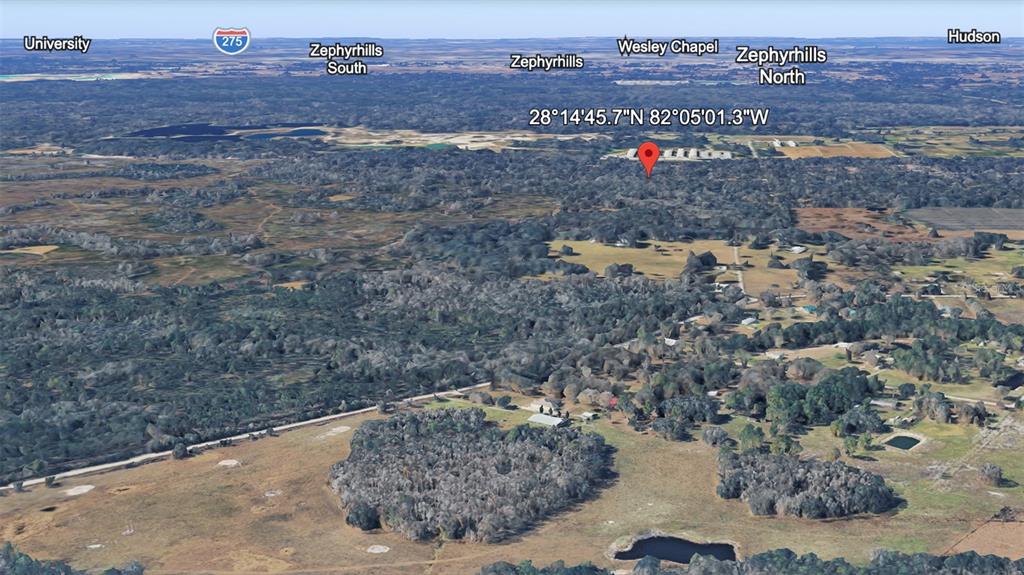 This is an aerial map view showing a rural landscape with scattered trees and buildings — UNKNOWN, KATHLEEN, FL