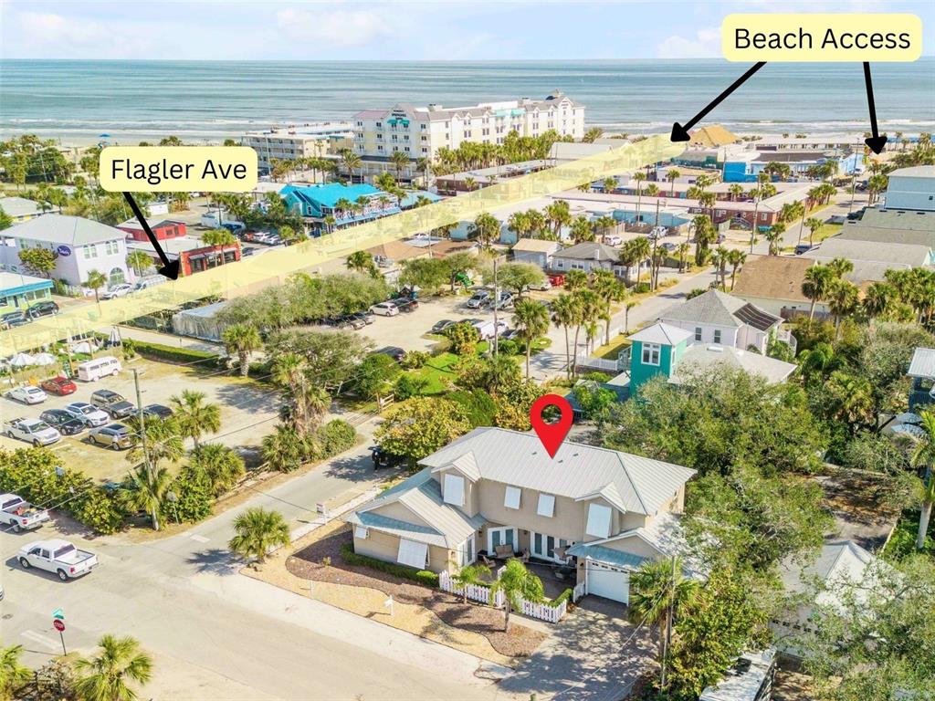 An aerial view shows a two-story house with a red location pin near the beach — 201 S COOPER STREET, NEW SMYRNA BEACH, FL