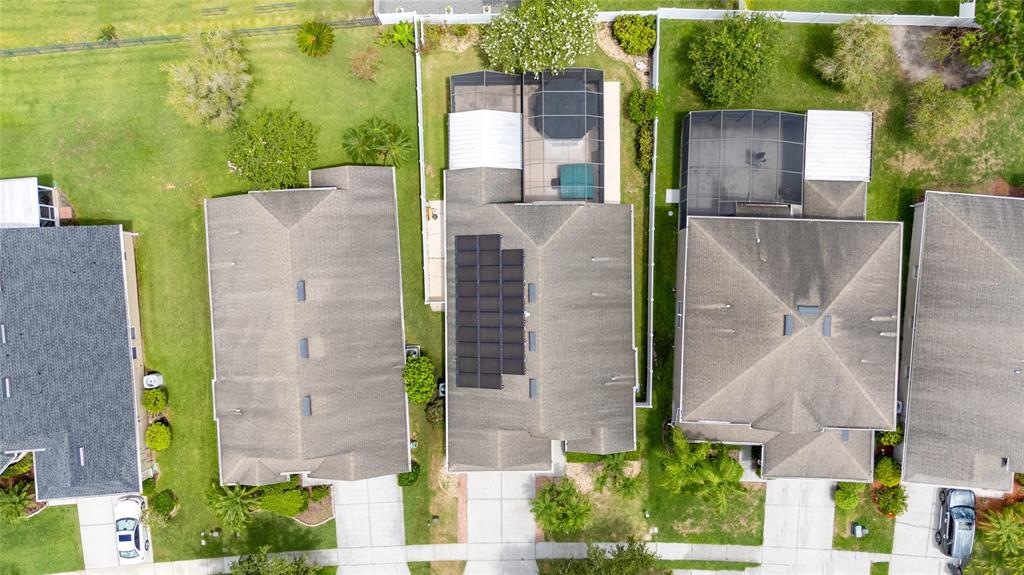 An aerial view shows several suburban houses with roofs, driveways, and screened-in back patios — 14617 KEELFORD WAY, ORLANDO, FL
