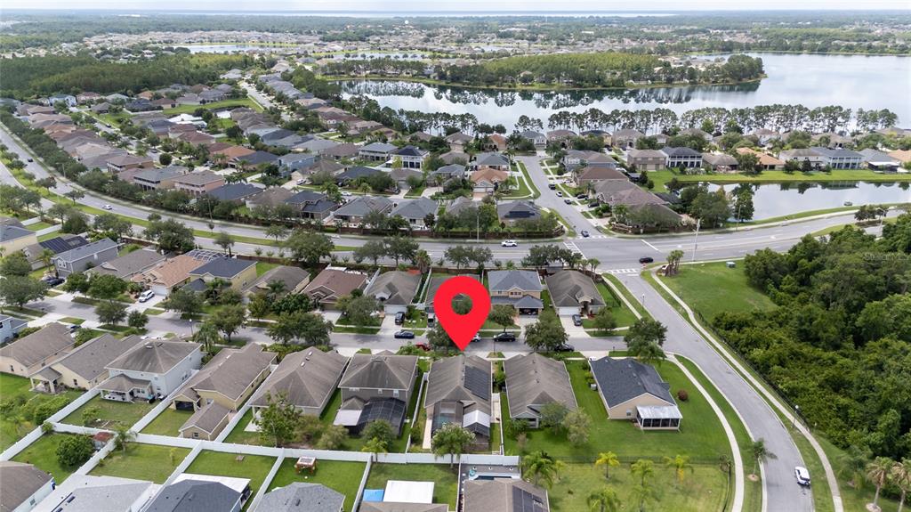 An aerial view shows a suburban neighborhood with houses, a lake, and a red location pin — 14617 KEELFORD WAY, ORLANDO, FL