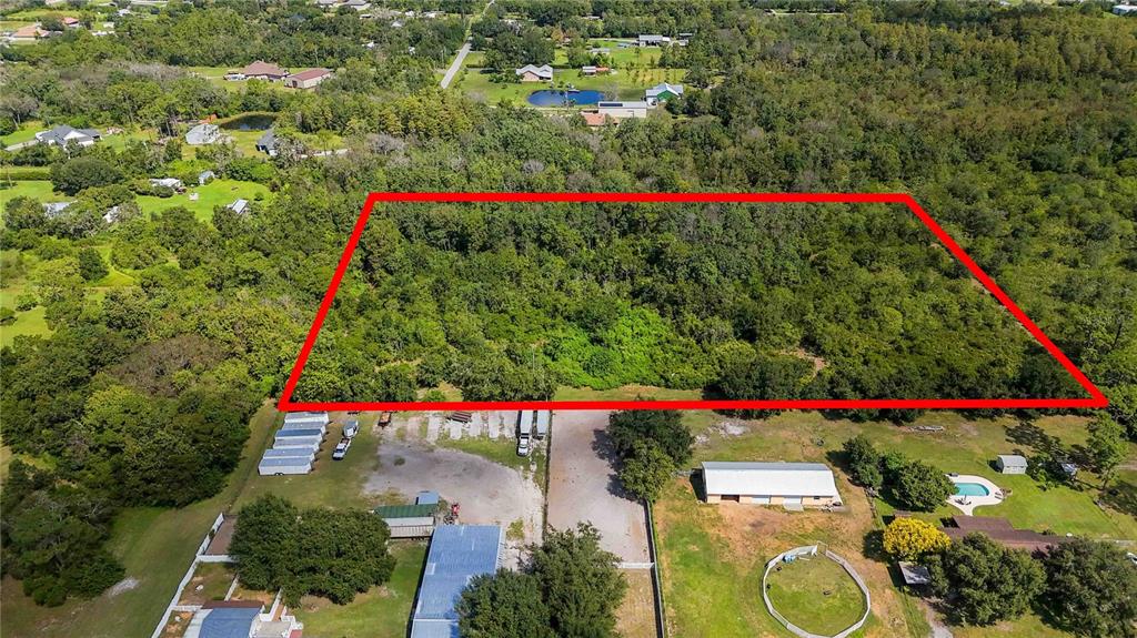 An aerial view shows a rectangular plot of wooded land outlined in red — 0 EDSEL AVENUE, ST CLOUD, FL