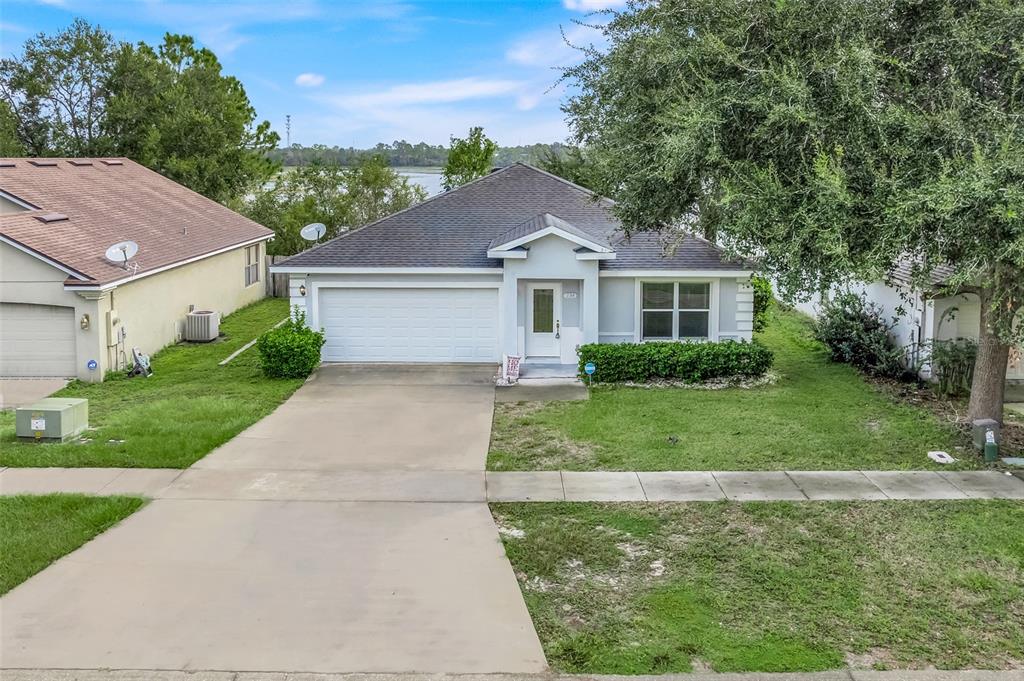 A white front door with a glass insert and the number 226 on the wall — 226 HAVERSHAM ROAD, DELTONA, FL