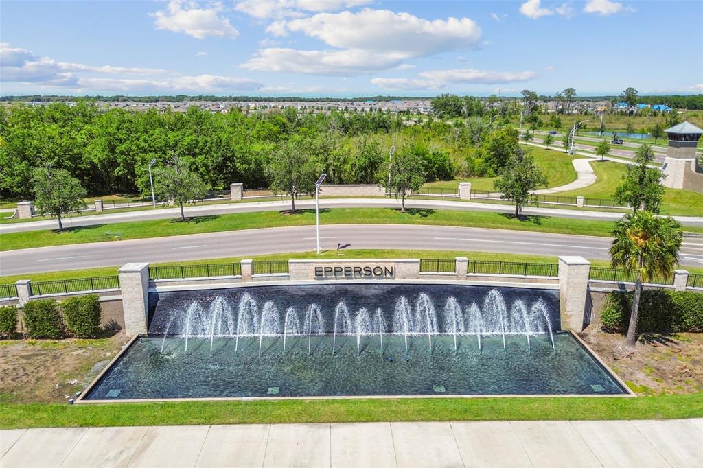 An aerial view shows a large water fountain feature with the name Epperson displayed prominently — 31840 SAPNA CHIME DRIVE, WESLEY CHAPEL, FL