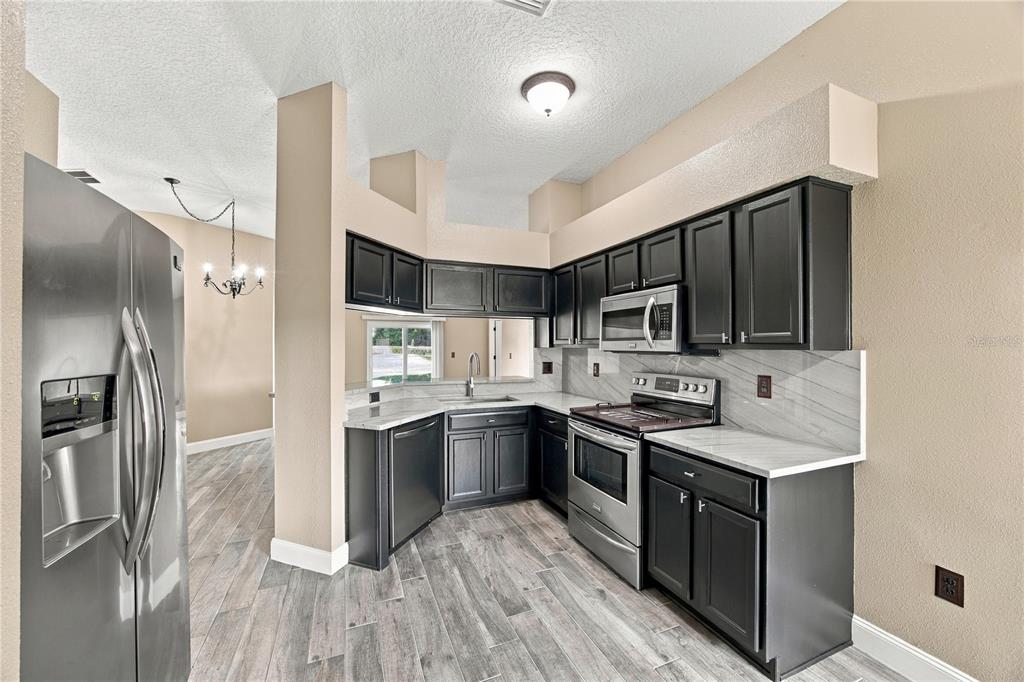 7919 MERCHANTVILLE CIRCLE, ZEPHYRHILLS, FL — photo 4 of 30