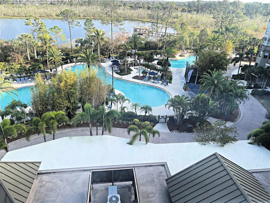 This is a floor plan rendering of a three-bedroom apartment with a solarium and balcony — 14501 GROVE RESORT AVE UNIT 1622, WINTER GARDEN, FL