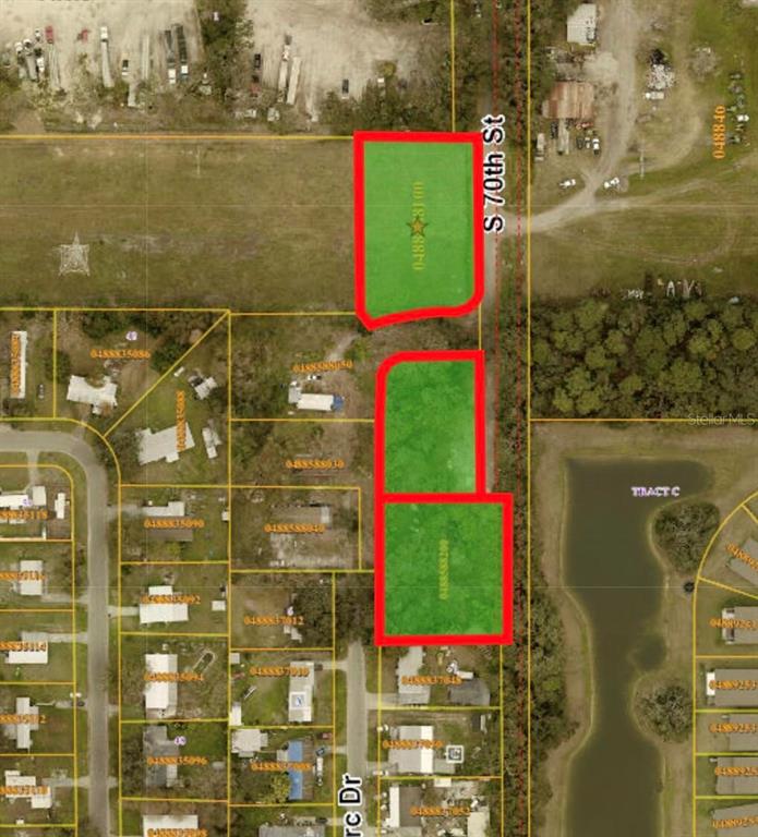 This is an aerial map showing three highlighted vacant land parcels along a road — 4411 S 70TH STREET, TAMPA, FL