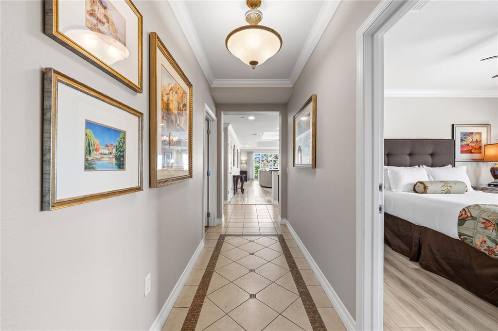An outdoor landing features a window, a white door, and a staircase with metal railings — 7613 CABANA COURT UNIT 304, KISSIMMEE, FL