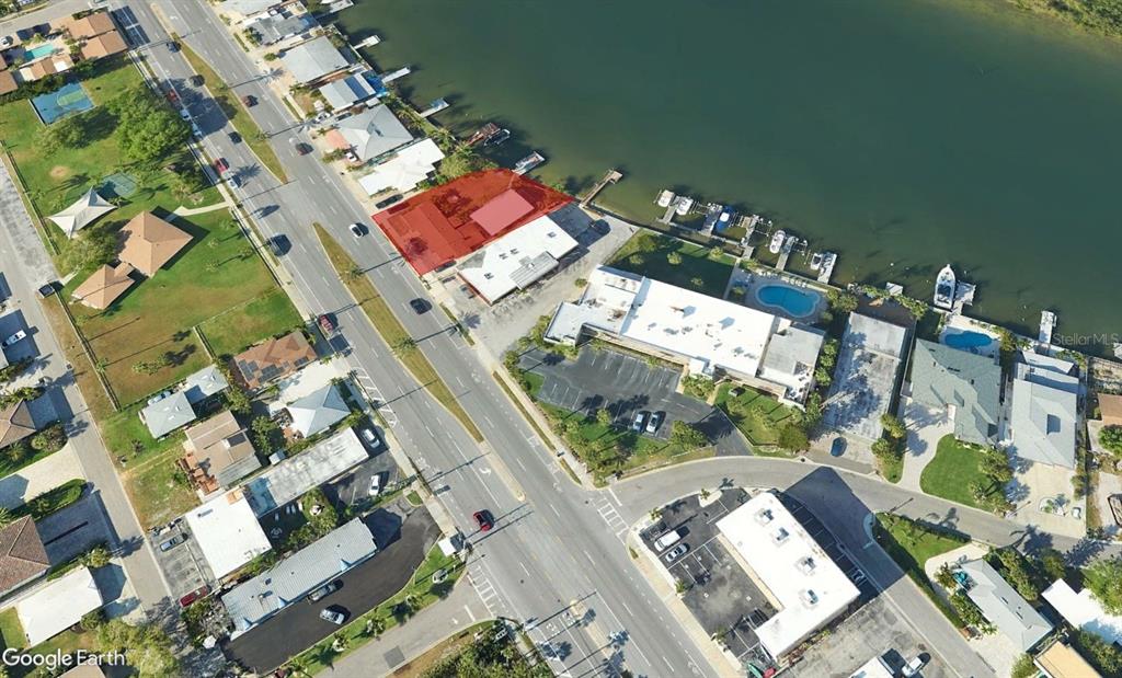 This aerial map view shows a waterfront commercial property highlighted in red along a road — 18207 GULF BOULEVARD, REDINGTON SHORES, FL