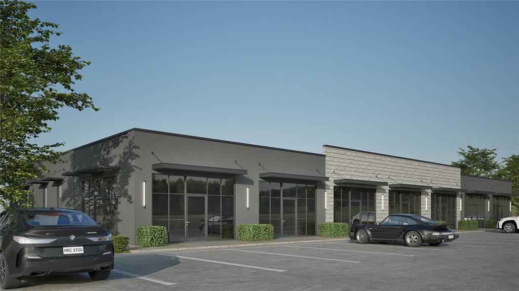 This is a digital rendering of a modern commercial building with a parking lot — 0 PROGRESS LANE UNIT 1, ST CLOUD, FL