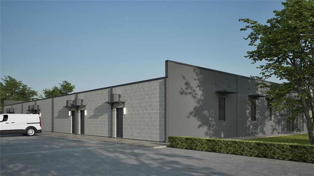 A digital rendering shows the exterior of a modern, gray concrete block industrial warehouse building — 0 PROGRESS LANE UNIT 1, ST CLOUD, FL
