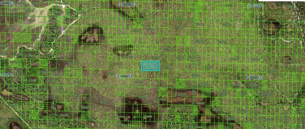 This is an aerial map showing a highlighted rectangular land parcel within a grid system — N/A, FROSTPROOF, FL