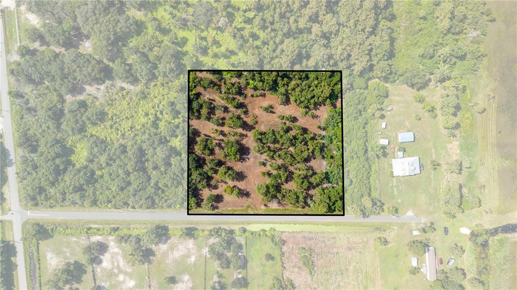 An aerial view shows a rectangular plot of land highlighted within a wooded area — 0 LAKE TERRACE AVE. SAINT CLOUD,FL UNIT 34772, ST CLOUD, FL