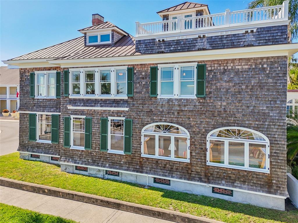 A three-story house with shingle siding, green shutters, and a rooftop deck — 178 AVENIDA MENENDEZ, ST AUGUSTINE, FL