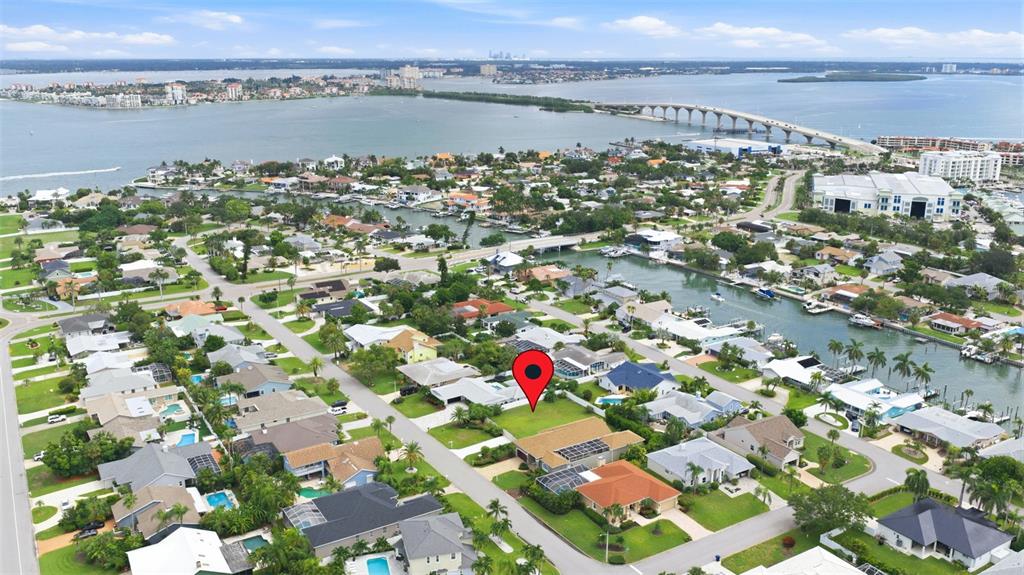 An aerial view shows a residential neighborhood with a red map pin marking a property — 343 7TH AVENUE N, TIERRA VERDE, FL