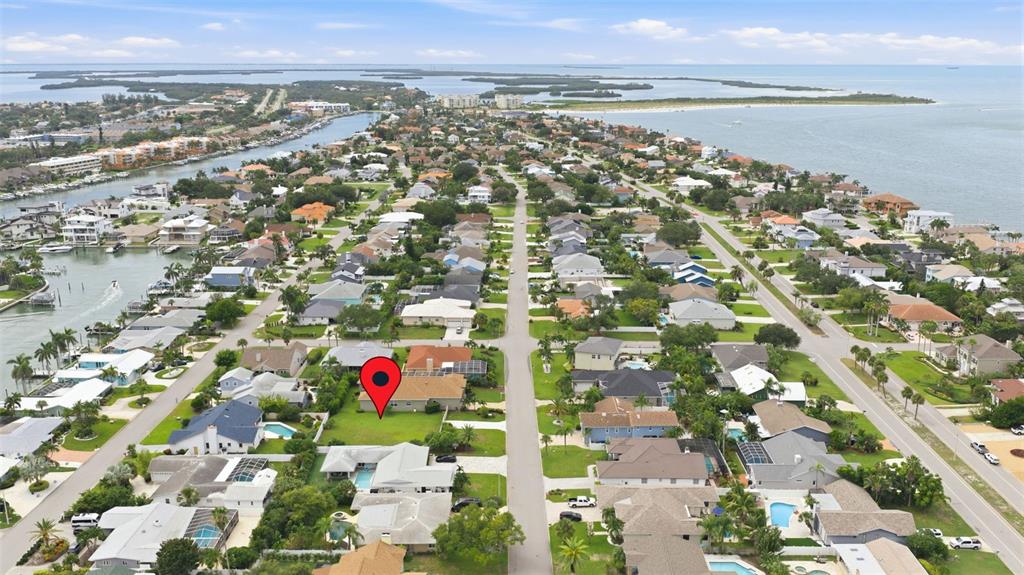 An aerial view shows a residential neighborhood with a red location pin on a house — 343 7TH AVENUE N, TIERRA VERDE, FL