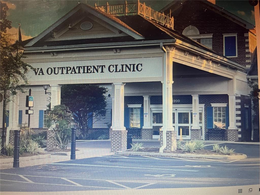 Exterior view of a brick VA outpatient clinic building with a covered entrance and parking lot — 9307 SE 159TH LANE, SUMMERFIELD, FL