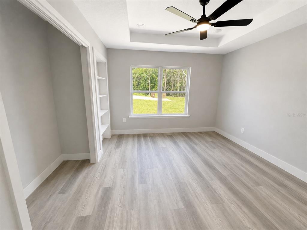 This is a floor plan for a three-bedroom, two-bathroom house with an attached garage — 12744 SE 102ND TERRACE, BELLEVIEW, FL