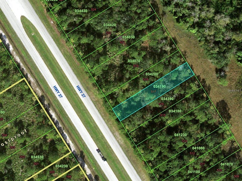 This is an aerial map showing a highlighted parcel of land next to a highway — US 27 HIGHWAY, FROSTPROOF, FL