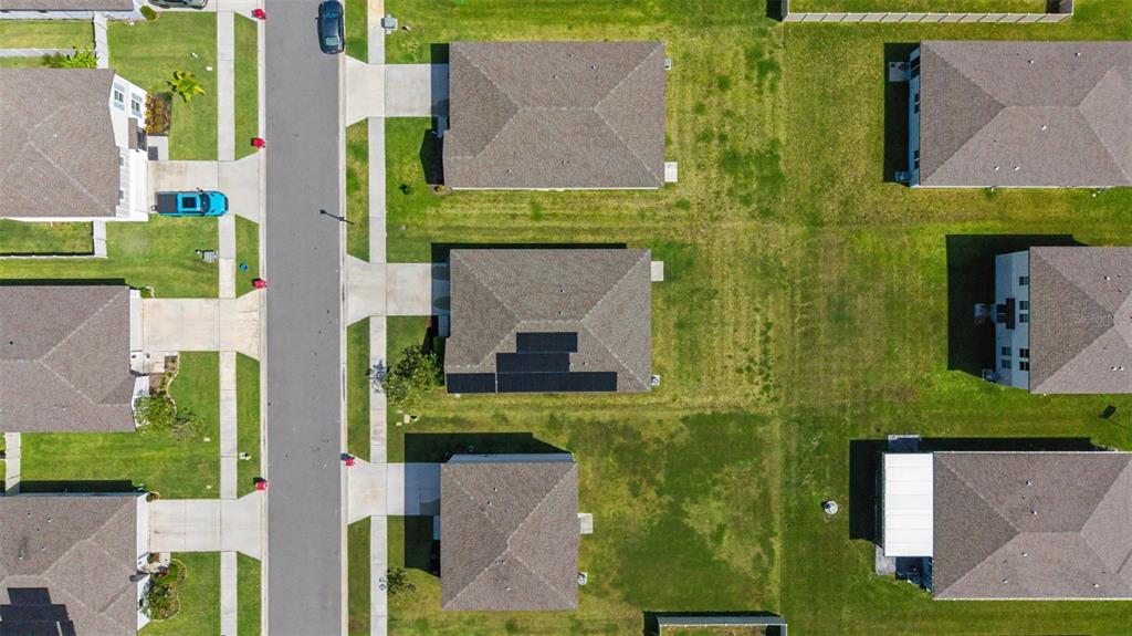 An aerial view shows several suburban houses with shingled roofs and green lawns — 234 LOVELY COURT, PLANT CITY, FL