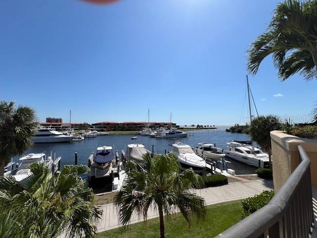 A view of a marina with multiple yachts docked on a sunny day — 3321 SUNSET KEY CIRCLE UNIT 308, PUNTA GORDA, FL