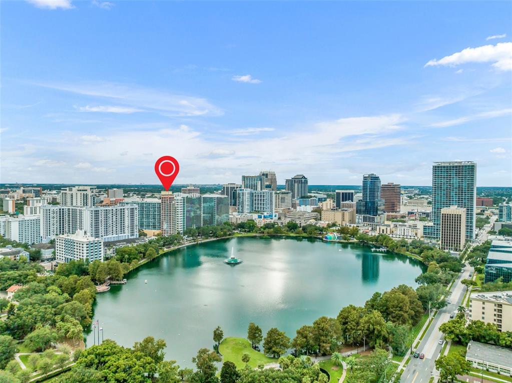 An aerial view of Lake Eola in downtown Orlando with a red pin marking a building — 322 E CENTRAL BOULEVARD UNIT 1913, ORLANDO, FL