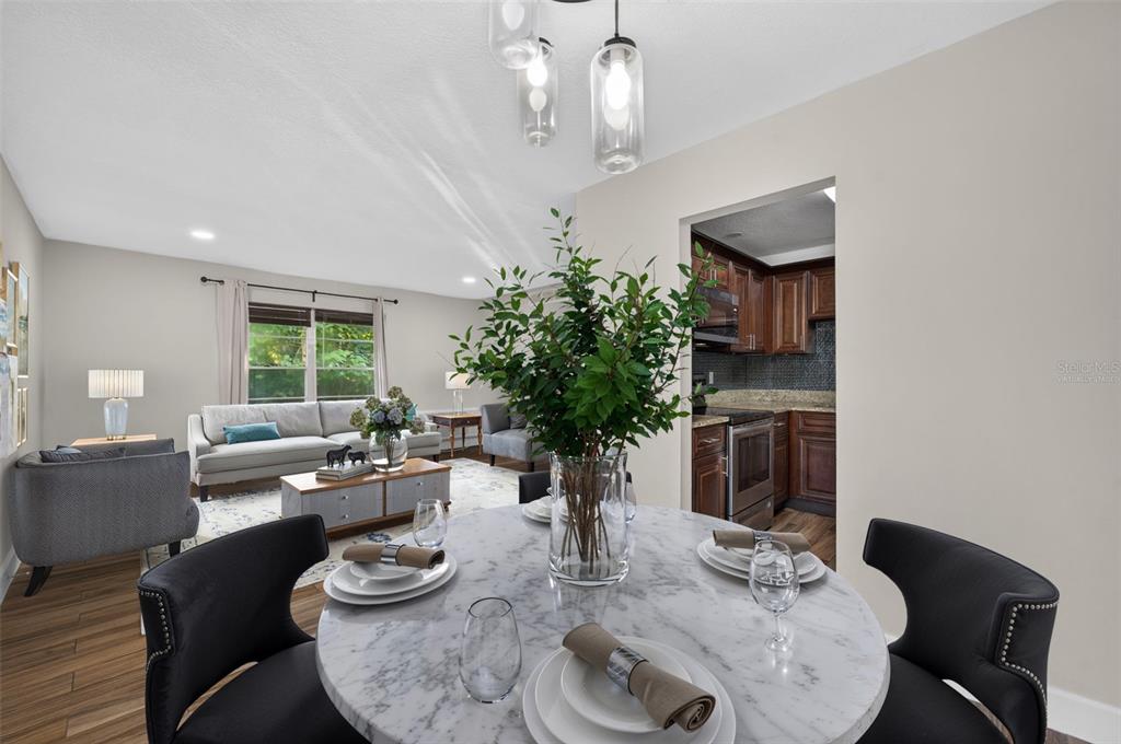 A gray door and sliding glass door are on a wooden deck of a building — 118 W AMERICA STREET UNIT 2, ORLANDO, FL