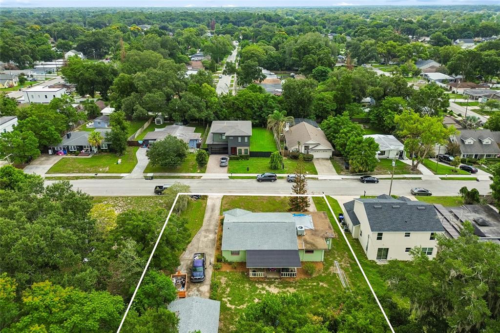 An aerial view shows a residential property with a green house and a detached garage — 3742 MARTIN STREET, ORLANDO, FL