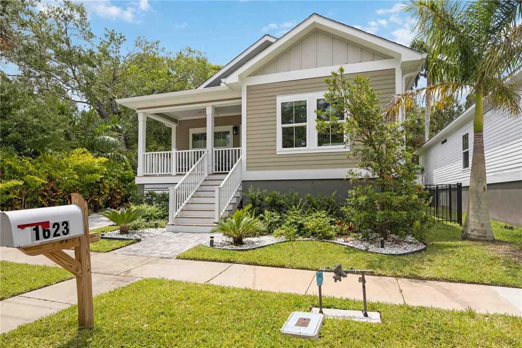 A single-story house with tan siding, a front porch, and a white mailbox in front — 1623 8TH AVENUE W, BRADENTON, FL