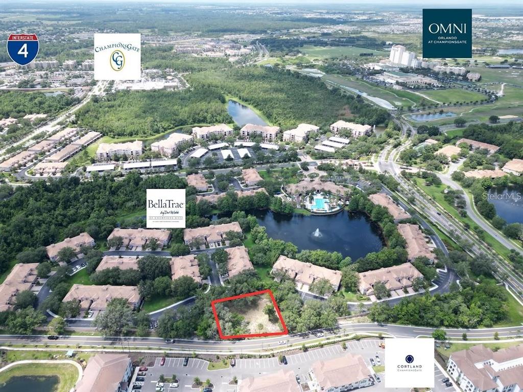 This aerial view shows a vacant, rectangular lot outlined in red within a residential community — 1320 S GOODMAN ROAD, DAVENPORT, FL