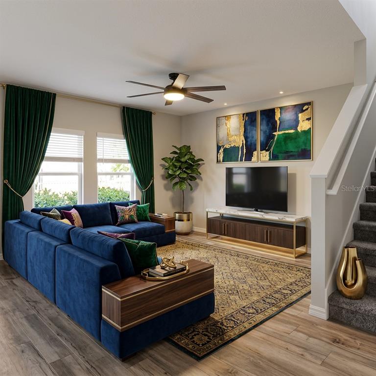 This rendering shows a living room with a blue sectional, green curtains, and a television — 14716 GALLOP RUN DRIVE, LITHIA, FL