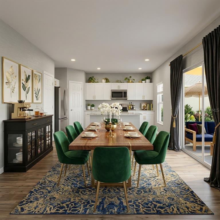 This rendering shows a dining room with a wooden table, green chairs, and kitchen cabinetry — 14716 GALLOP RUN DRIVE, LITHIA, FL