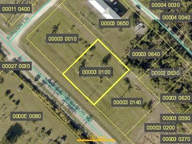 This is an aerial map showing a vacant lot highlighted in yellow — 13790 STRINGFELLOW ROAD, BOKEELIA, FL