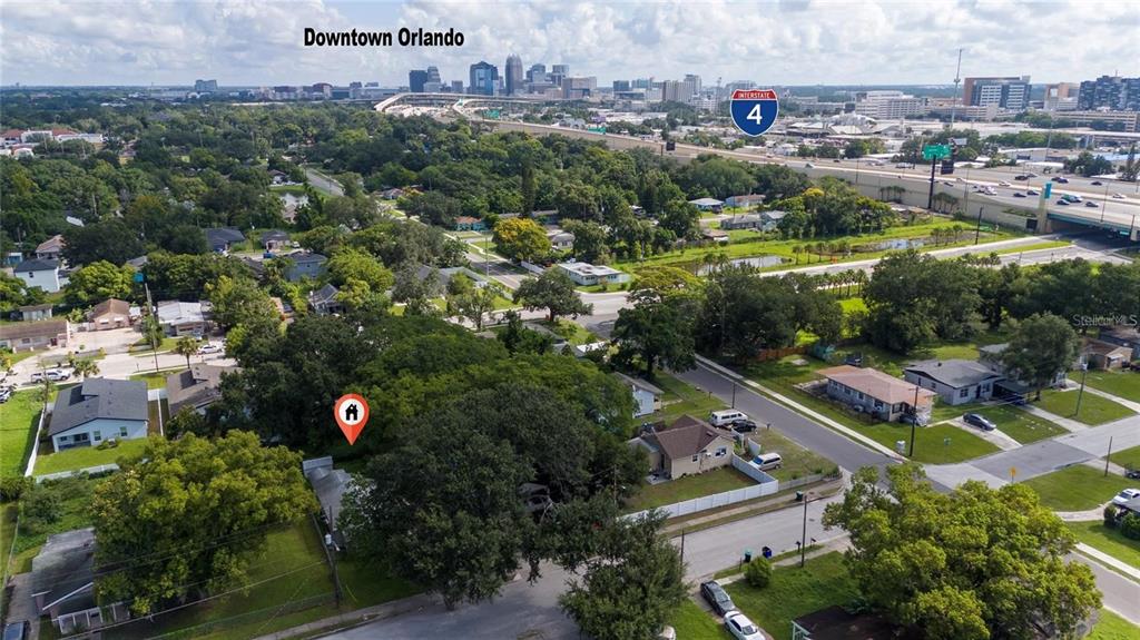 An aerial view shows a residential neighborhood with a house marked by a location pin — 713 22ND STREET, ORLANDO, FL