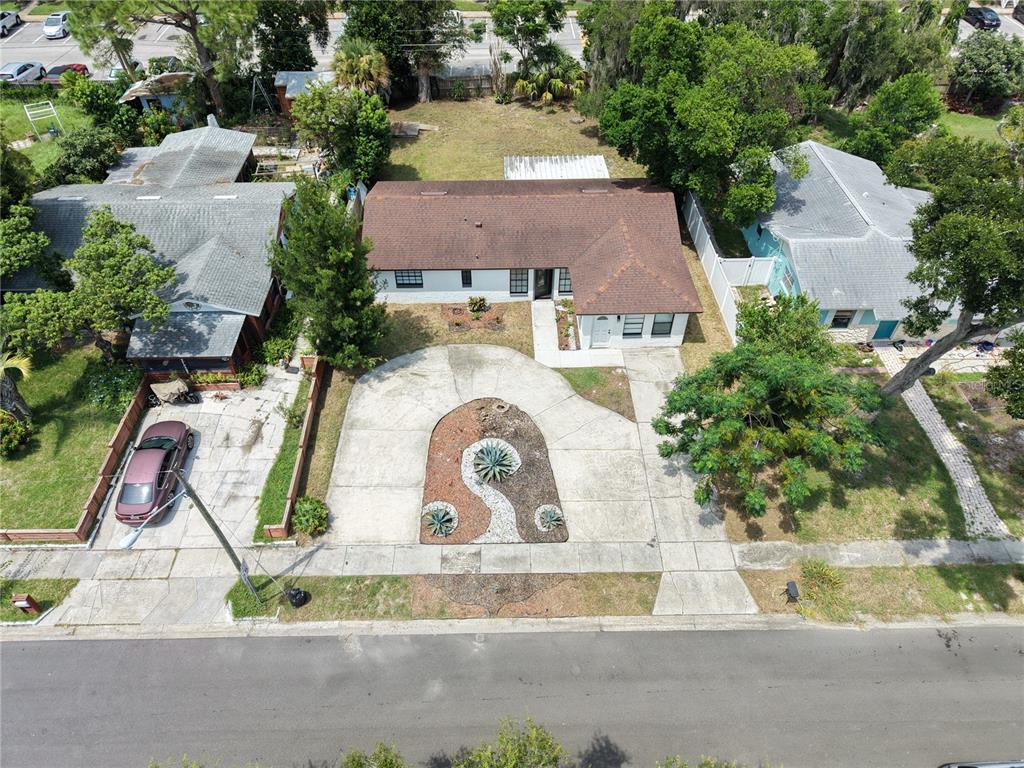 An aerial view shows a single-story house with a brown roof and a circular driveway — 2181 LINDEN ROAD, WINTER PARK, FL
